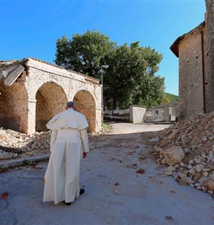 Pope Francis walks among debris and damaged buildings after the central-Italy earthquake