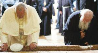 Pope Francis prays at the Holy Sepulcher with Bartholomew I.