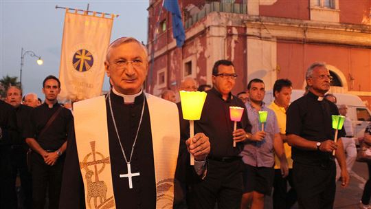 Monsignor Filippo Santoro during a vigil for the ILVA workers in Taranto 