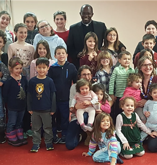 The children in Boston with Fr. Marcel